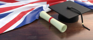 uk-education-studies-college-university-diploma-roll-wooden-office-desk-3d-illustration
